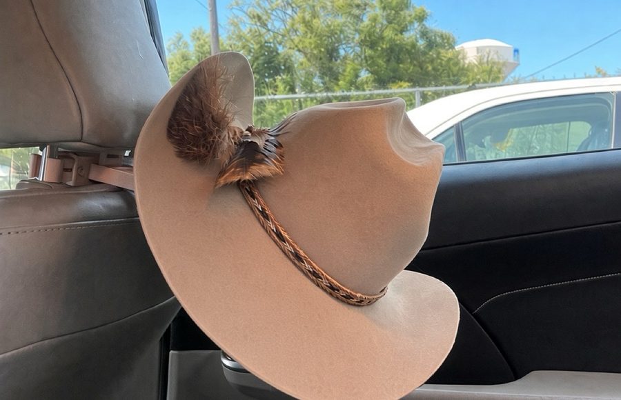 Cowboy hat held crown-up on a truck headrest